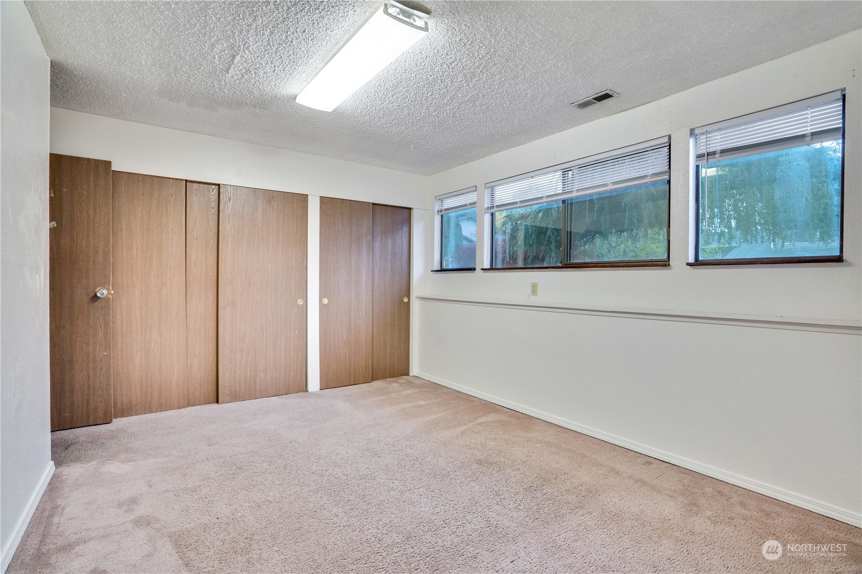 2813 Southwest 342nd Street Federal Way, WA 98023 - Photo 16 of 34 a view of an empty room with window and closet