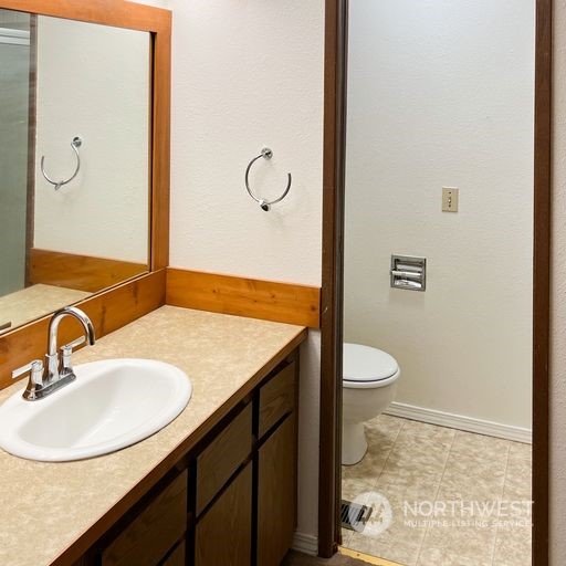 2813 Southwest 342nd Street Federal Way, WA 98023 - Photo 17 of 34 a bathroom with a sink a toilet and shower