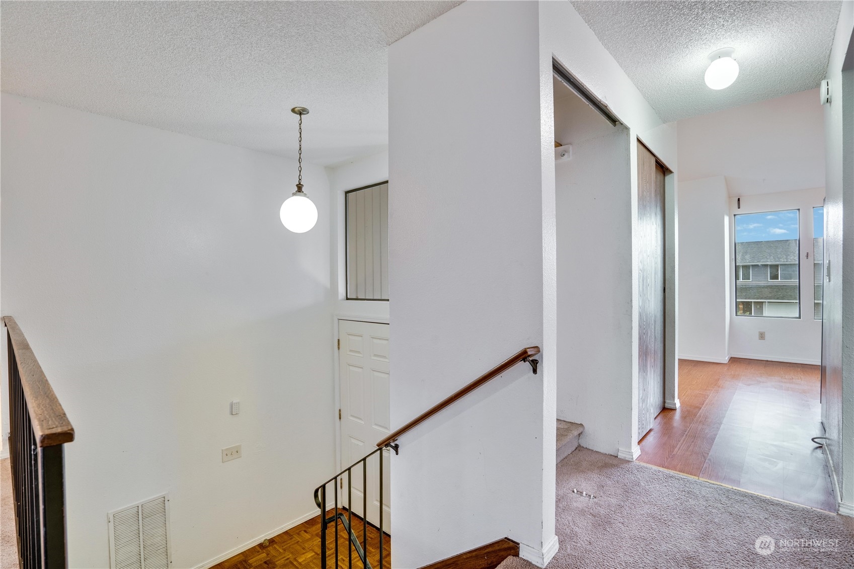2813 Southwest 342nd Street Federal Way, WA 98023 - Photo 20 of 34 a view of a hallway with wooden floor and staircase