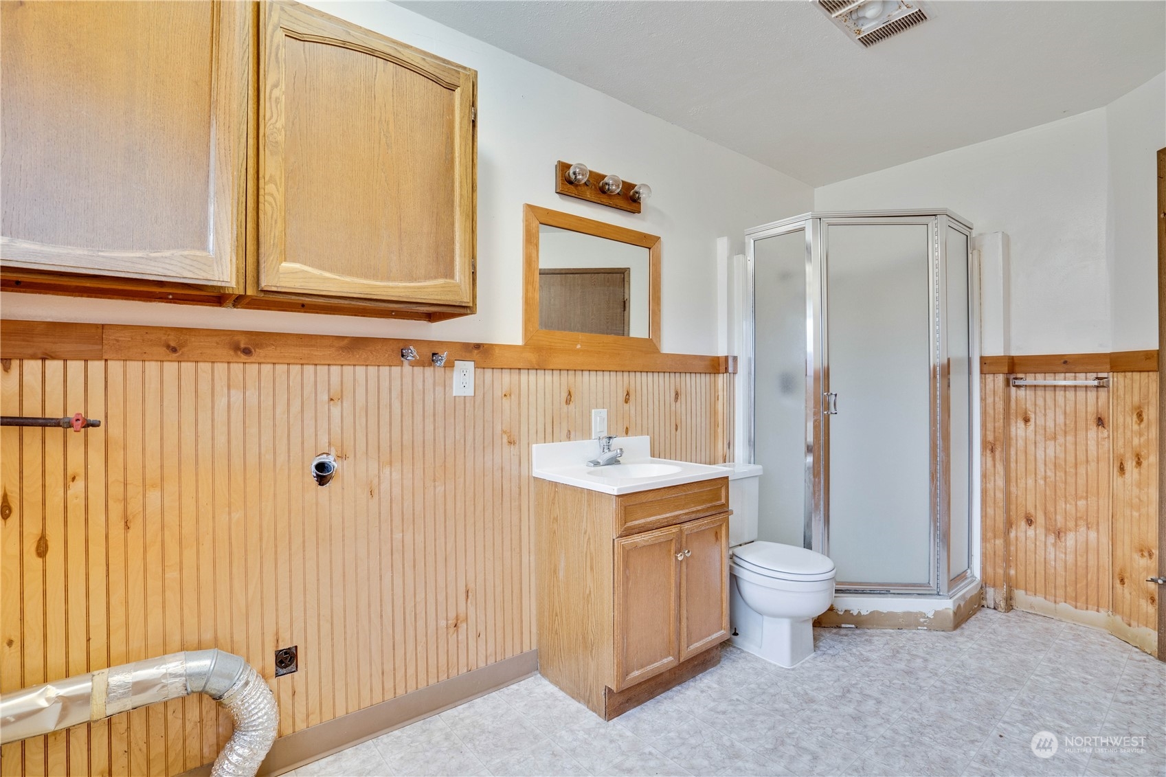 2813 Southwest 342nd Street Federal Way, WA 98023 - Photo 23 of 34 a bathroom with a toilet a sink and a shower