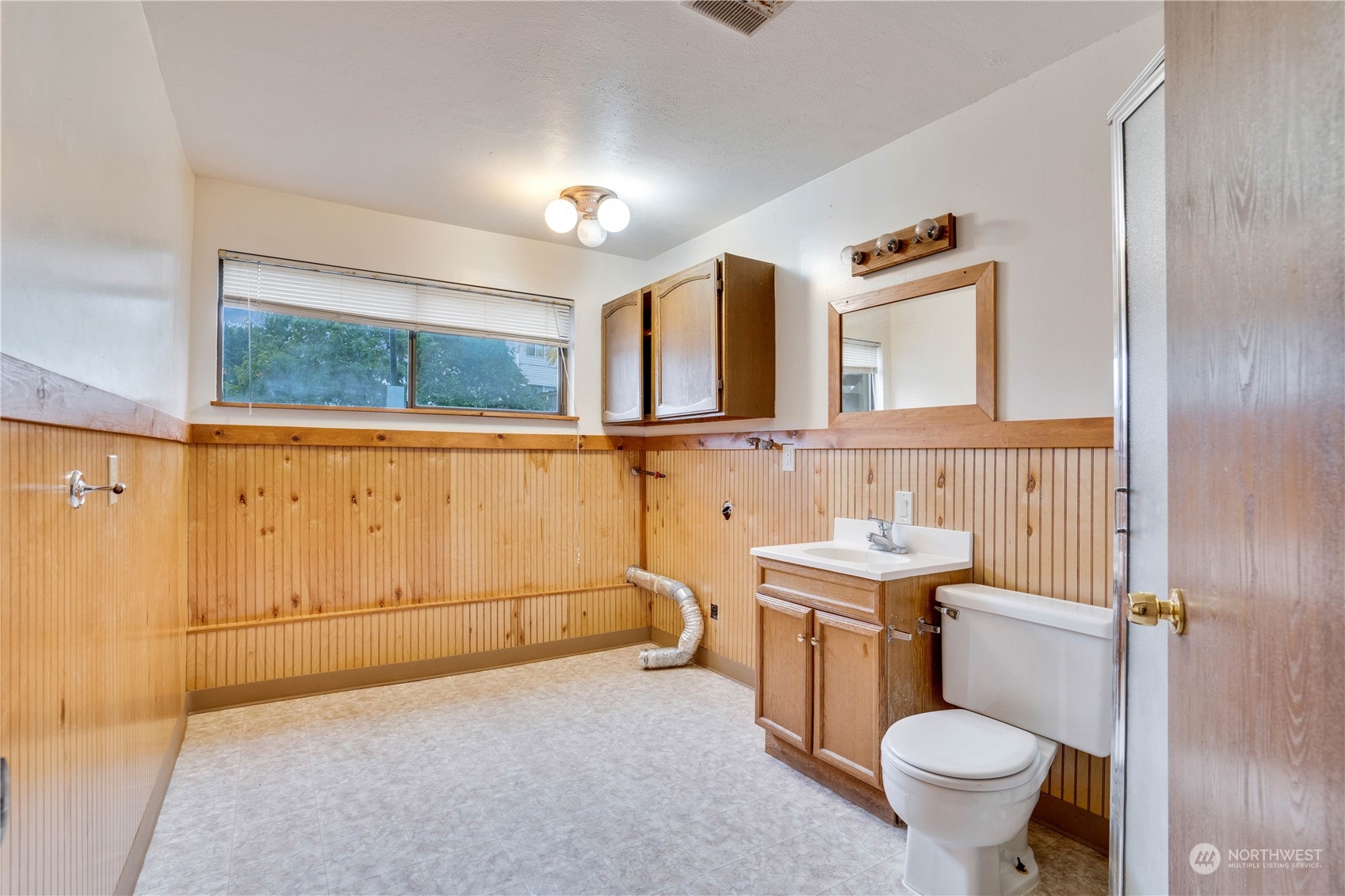 2813 Southwest 342nd Street Federal Way, WA 98023 - Photo 24 of 34 a bathroom with a sink a toilet and mirror