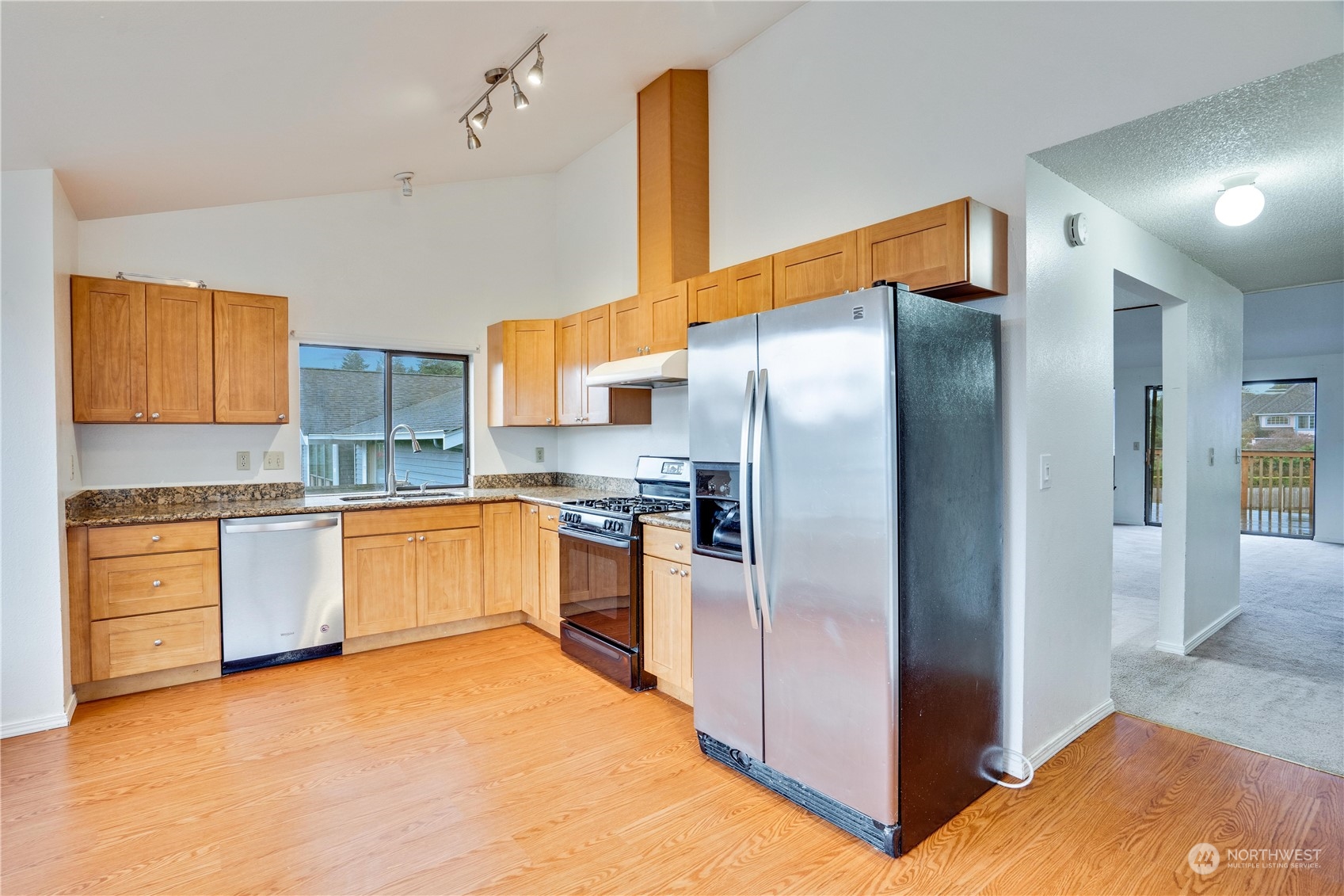 2813 Southwest 342nd Street Federal Way, WA 98023 - Photo 6 of 34 a kitchen with stainless steel appliances a refrigerator and a sink