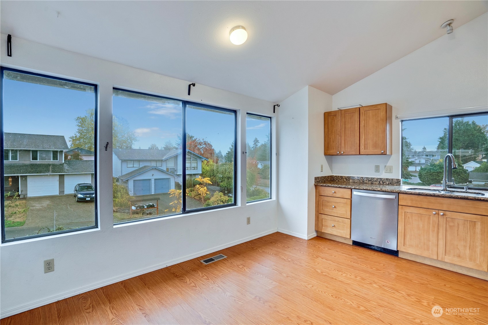 2813 Southwest 342nd Street Federal Way, WA 98023 - Photo 7 of 34 a kitchen with stainless steel appliances granite countertop a stove a sink and a refrigerator