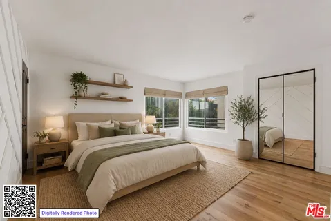 a bedroom with a large bed and a window