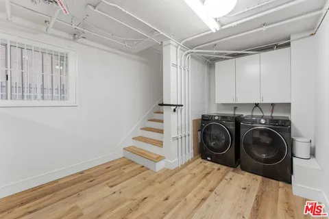 a view of a storage & utility room with wooden floor