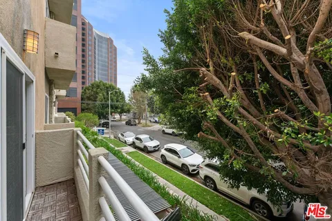 a view of a backyard with sitting area