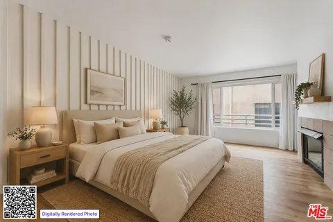 a bedroom with a bed a mirror and a large window
