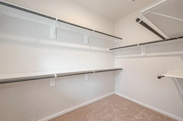 a view of a room with racks on the wall