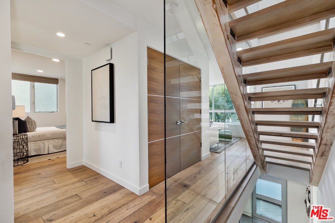 808 Brooks Avenue Venice, CA 90291 - Photo 21 of 47 a view of a hallway with wooden floor and staircase