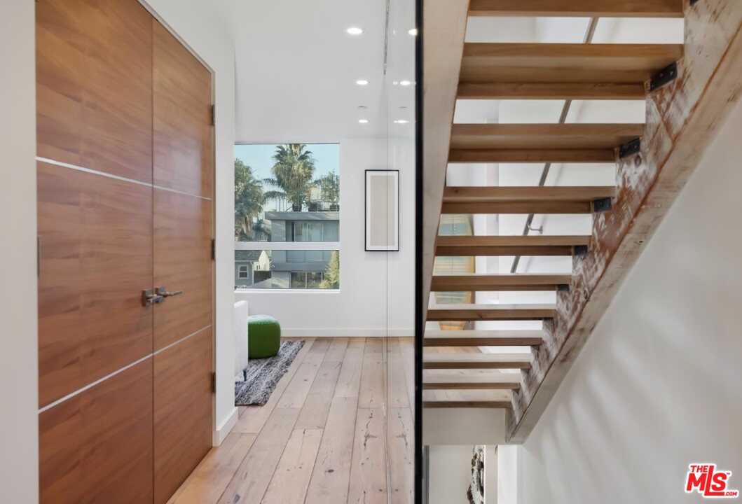 808 Brooks Avenue Venice, CA 90291 - Photo 22 of 47 a view of a hallway with wooden floor and staircase