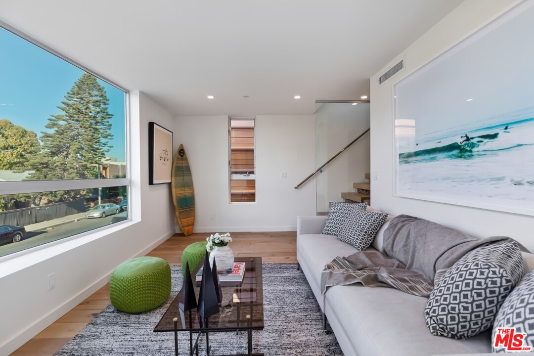 808 Brooks Avenue Venice, CA 90291 - Photo 24 of 47 a living room with furniture and a large window