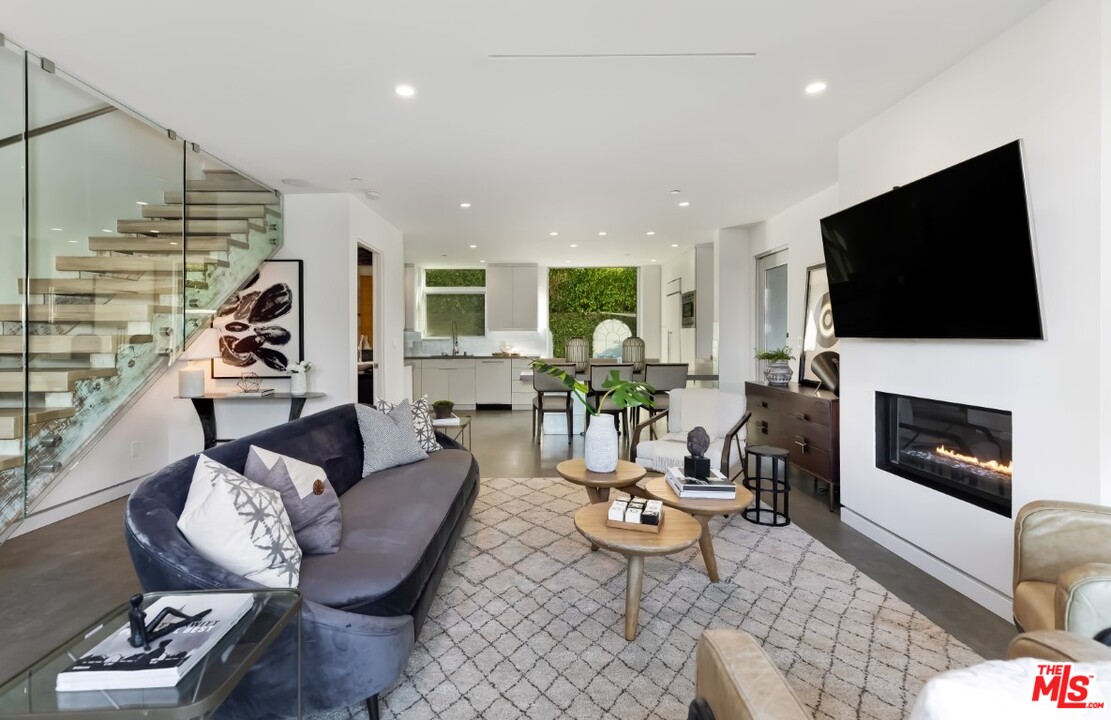 808 Brooks Avenue Venice, CA 90291 - Photo 6 of 47 a living room with fireplace furniture and a flat screen tv