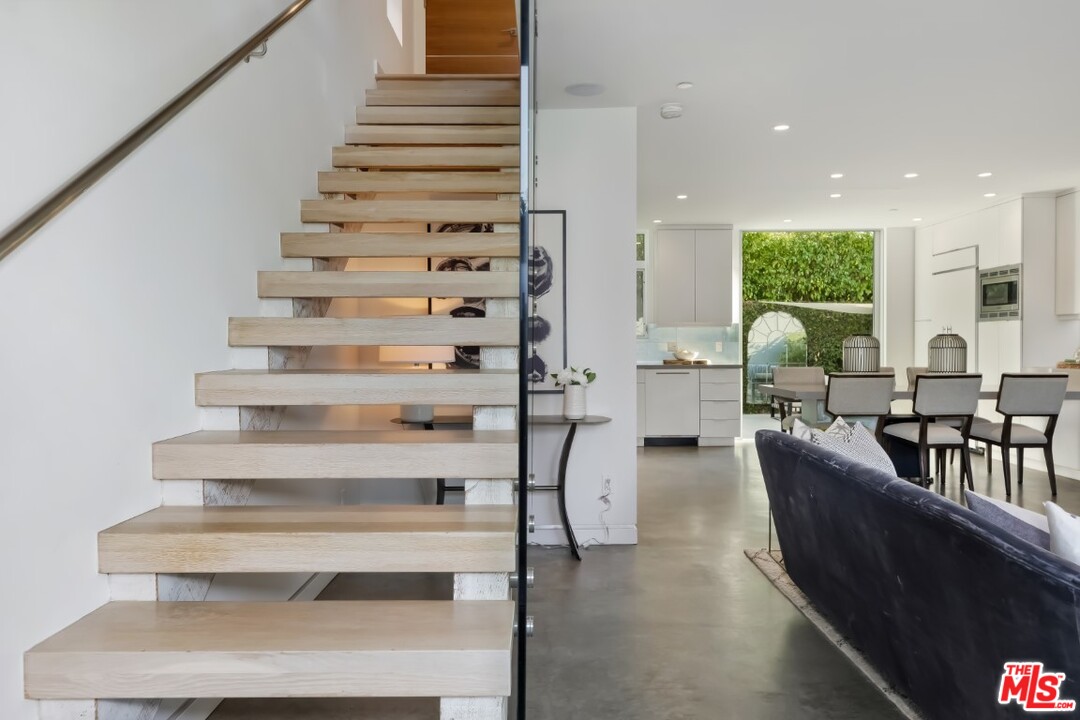 808 Brooks Avenue Venice, CA 90291 - Photo 9 of 47 a living room with furniture and a large window