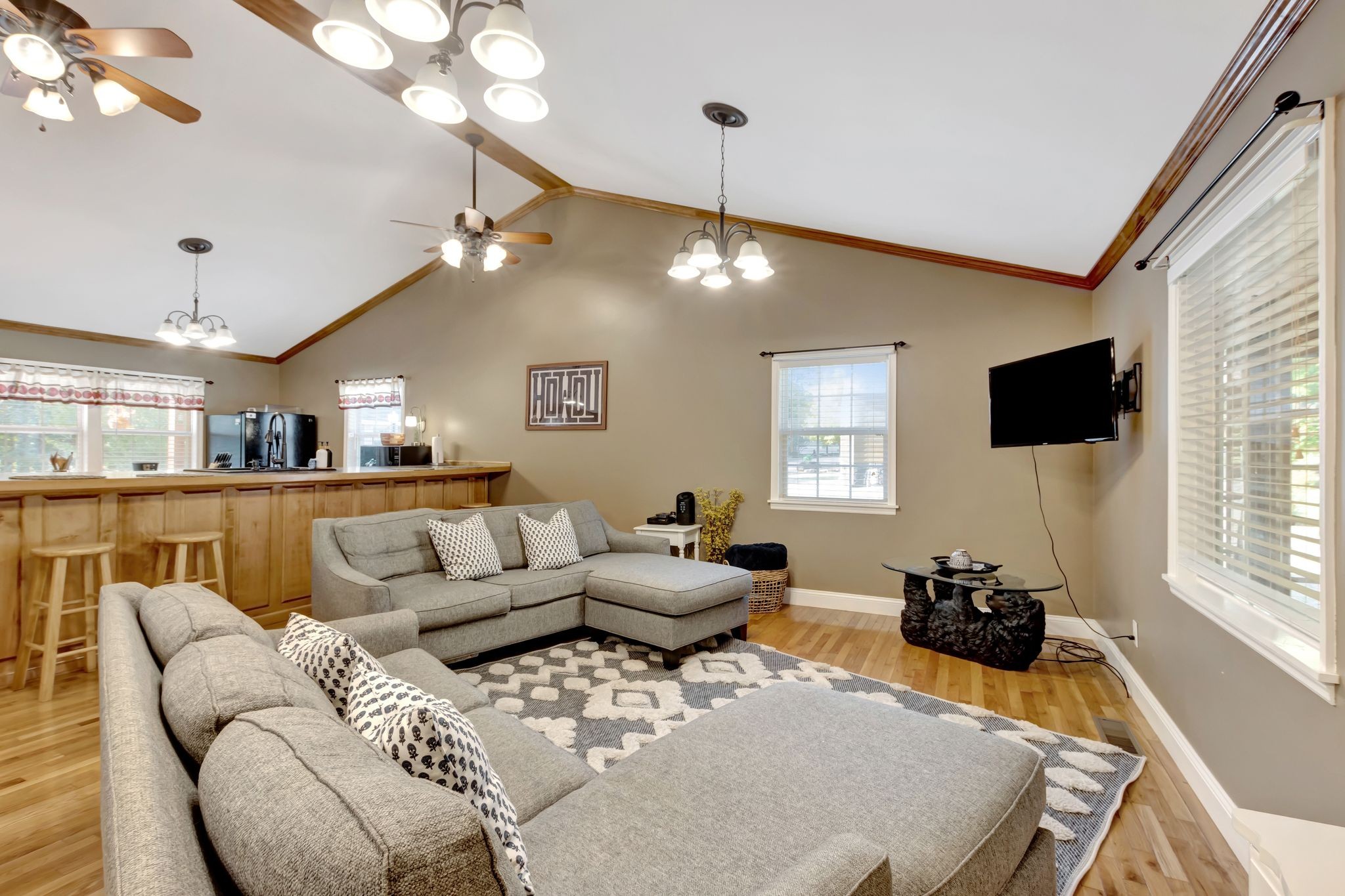 11845 Highway 41 Monteagle, TN 37356 - Photo 23 of 74 a living room with furniture a flat screen tv and kitchen view