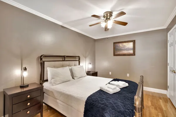 a view of backyard with table and chairs and potted plants