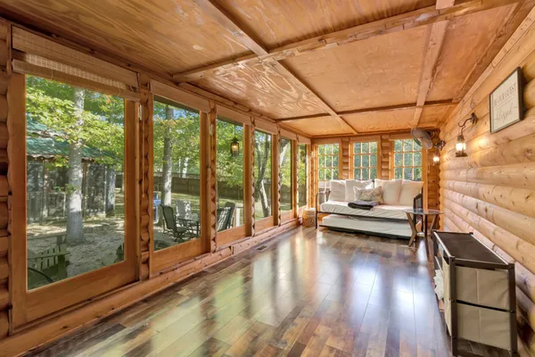 a view of a dining room with furniture and wooden floor