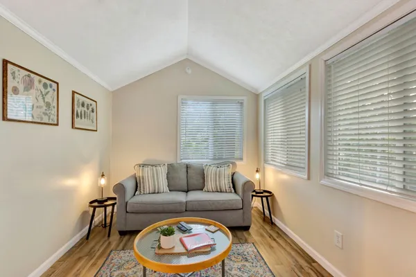 a view of a house with a yard and garage