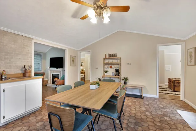 a group of chairs sitting in a room next to a yard