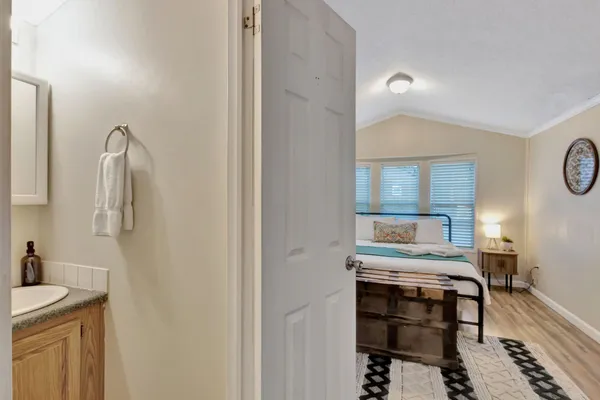 a very nice looking room with wooden floor and staircase