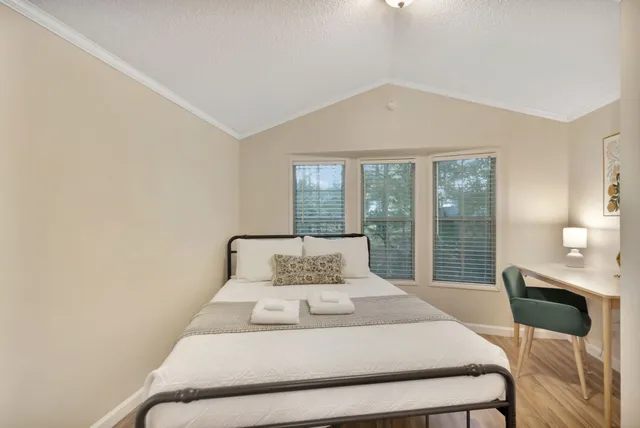 a kitchen with stainless steel appliances granite countertop a sink a stove and refrigerator