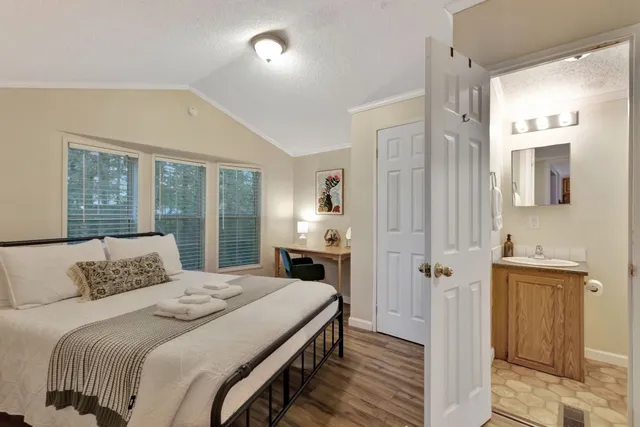 a kitchen with kitchen island a counter space a stove and a refrigerator