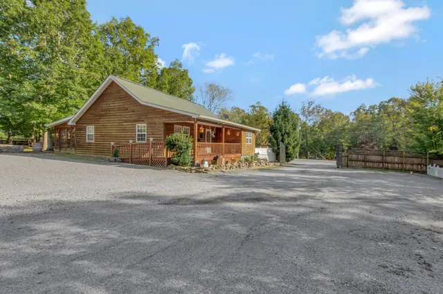 a large kitchen with kitchen island a large counter space appliances and cabinets