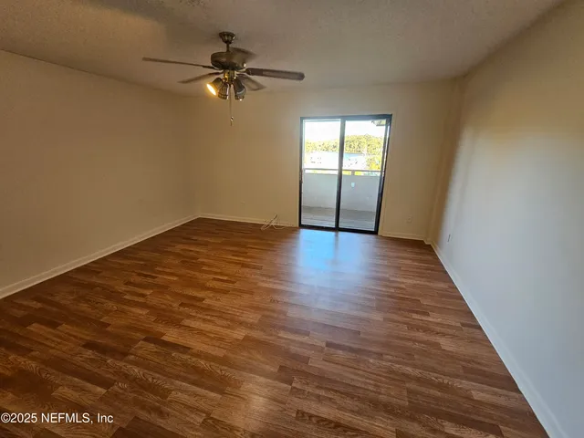 a view of an empty room and window
