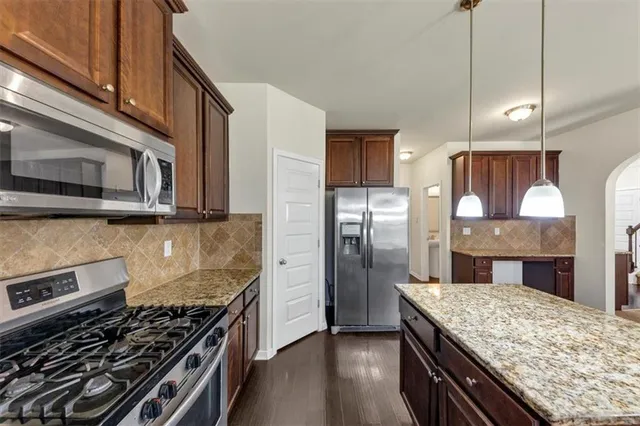 a bathroom with a sink a mirror and a toilet