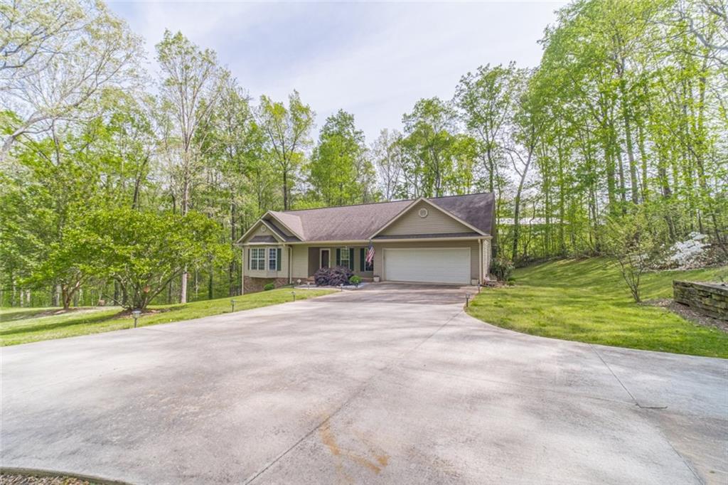 4761 East Hall Road Gainesville, GA 30507 - Photo 1 of 1 a front view of a house with a yard and trees