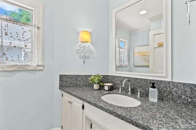 a view of a balcony with chairs and a table