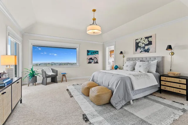 a living room with furniture and view of kitchen