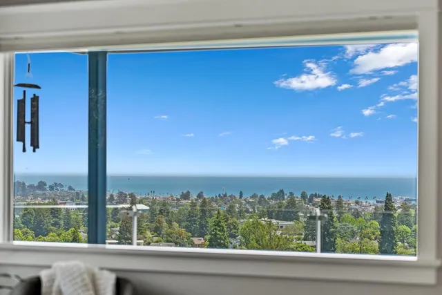 a view of backyard with swimming pool and porch