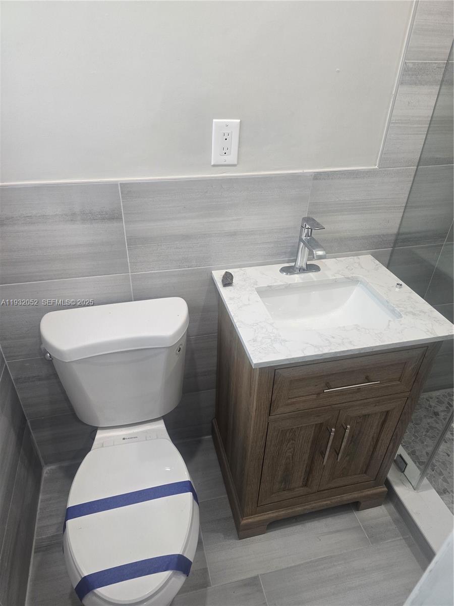 3300 Southeast 6th Street, Unit 6 Pompano Beach, FL 33062 - Photo 4 of 7 a bathroom with a sink and a toilet