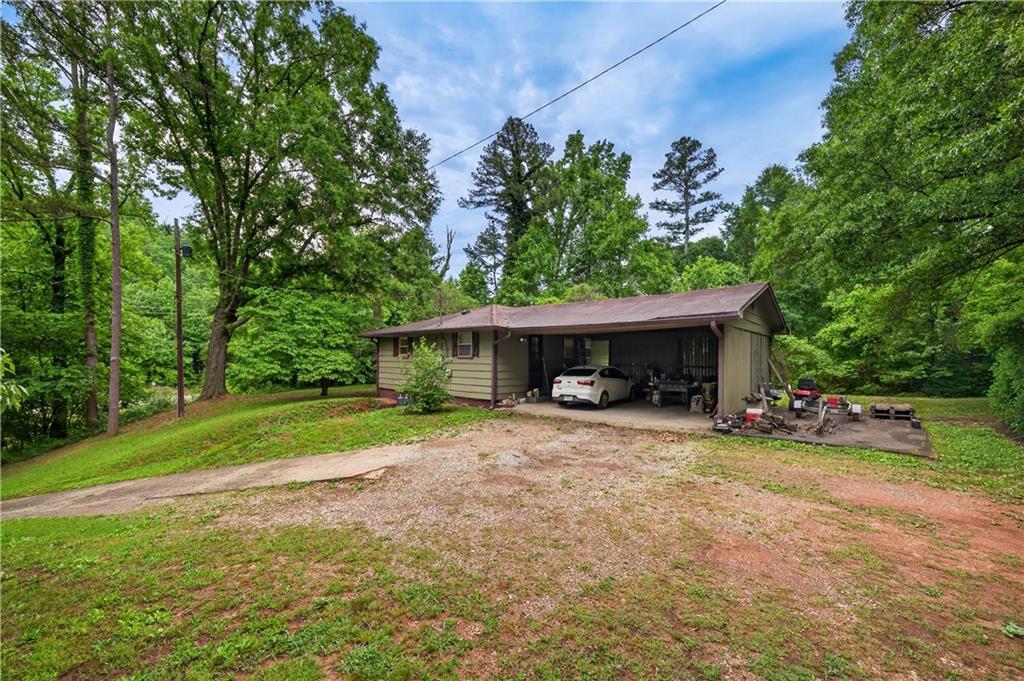 4399 Highway 411 Rydal, GA 30171 - Photo 21 of 37 a view of a house with a yard and sitting area