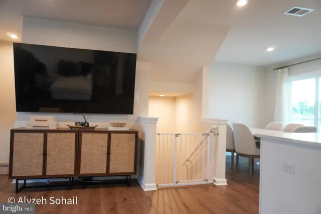 a living room with a flat screen tv and furniture