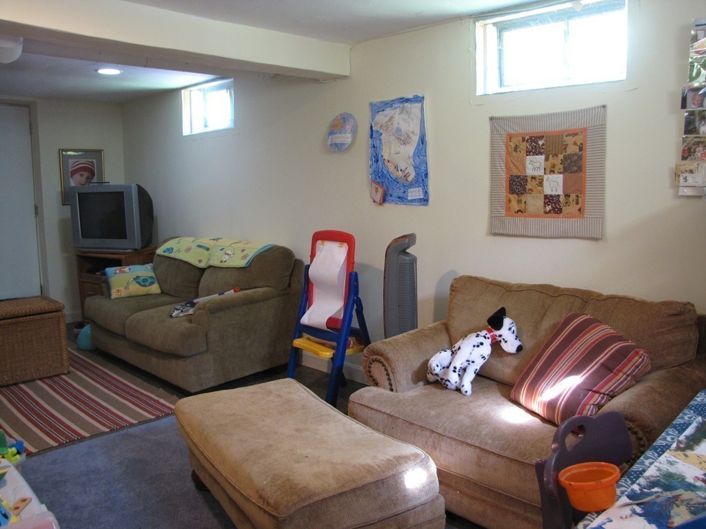 57 Sturbridge Road Holland, MA 01521 - Photo 15 of 18 a living room with furniture chess board and a window