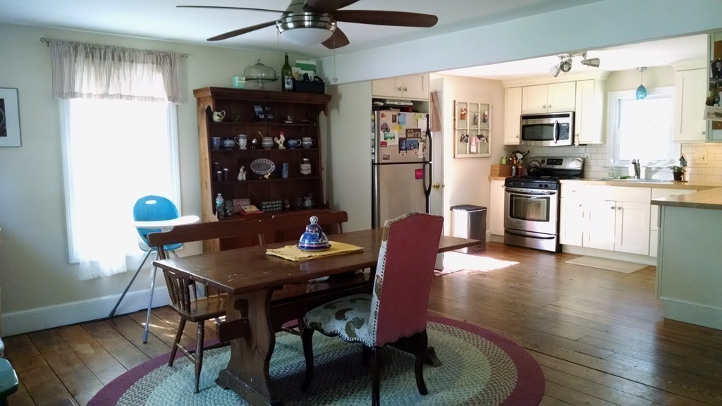 57 Sturbridge Road Holland, MA 01521 - Photo 7 of 18 a view of a dining room with furniture and wooden floor