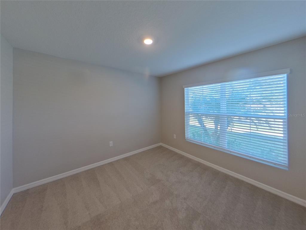 Undisclosed Address Ruskin, FL 33570 - Photo 11 of 18 an empty room with a window