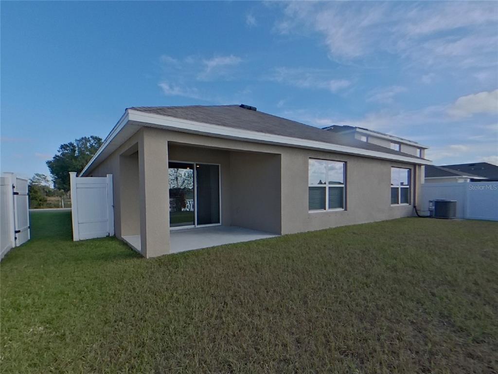 Undisclosed Address Ruskin, FL 33570 - Photo 18 of 18 a view of a house with a yard