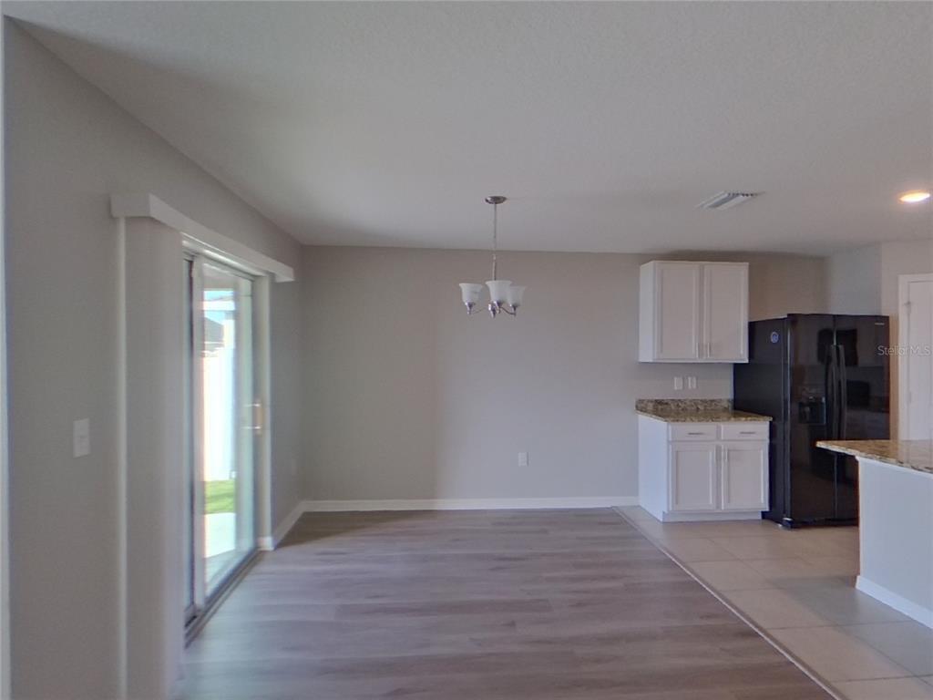 Undisclosed Address Ruskin, FL 33570 - Photo 4 of 18 a view of kitchen with granite countertop cabinets and refrigerator