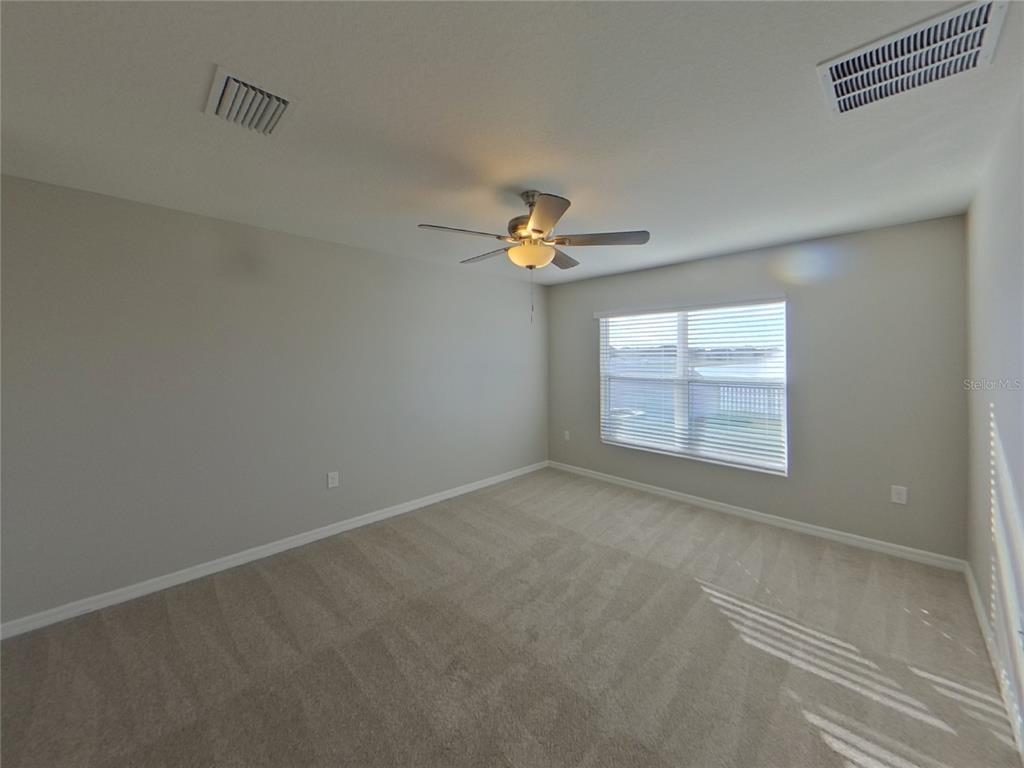 Undisclosed Address Ruskin, FL 33570 - Photo 7 of 18 a view of an empty room with a window