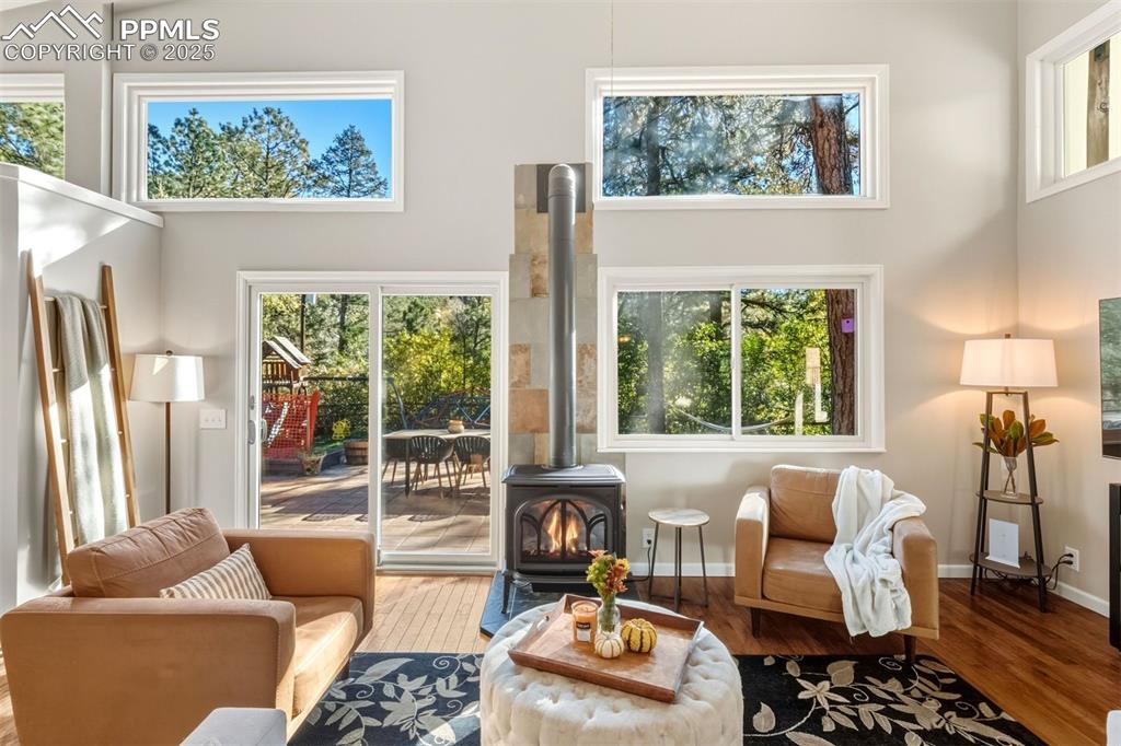 1144 Rock Creek Canyon Road, Unit A Colorado Springs, CO 80926 - Photo 11 of 50 a living room with furniture and a floor to ceiling window