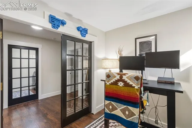 a bedroom with two beds and a window