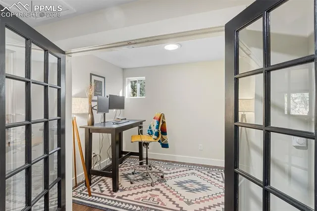 a view of an entryway with wooden floor