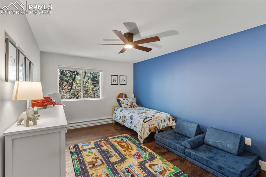 1144 Rock Creek Canyon Road, Unit A Colorado Springs, CO 80926 - Photo 22 of 50 a bedroom with two beds and a window