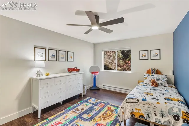 a bedroom with two beds and a window