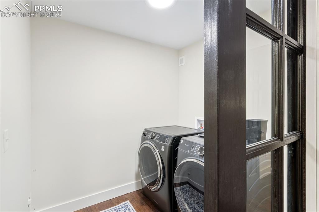 1144 Rock Creek Canyon Road, Unit A Colorado Springs, CO 80926 - Photo 27 of 50 a view of a hallway with washer and dryer