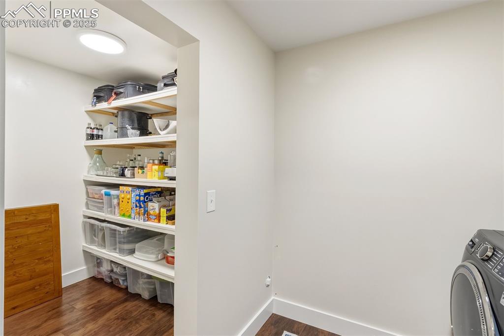 1144 Rock Creek Canyon Road, Unit A Colorado Springs, CO 80926 - Photo 28 of 50 a view of workspace with wooden floor and shelf