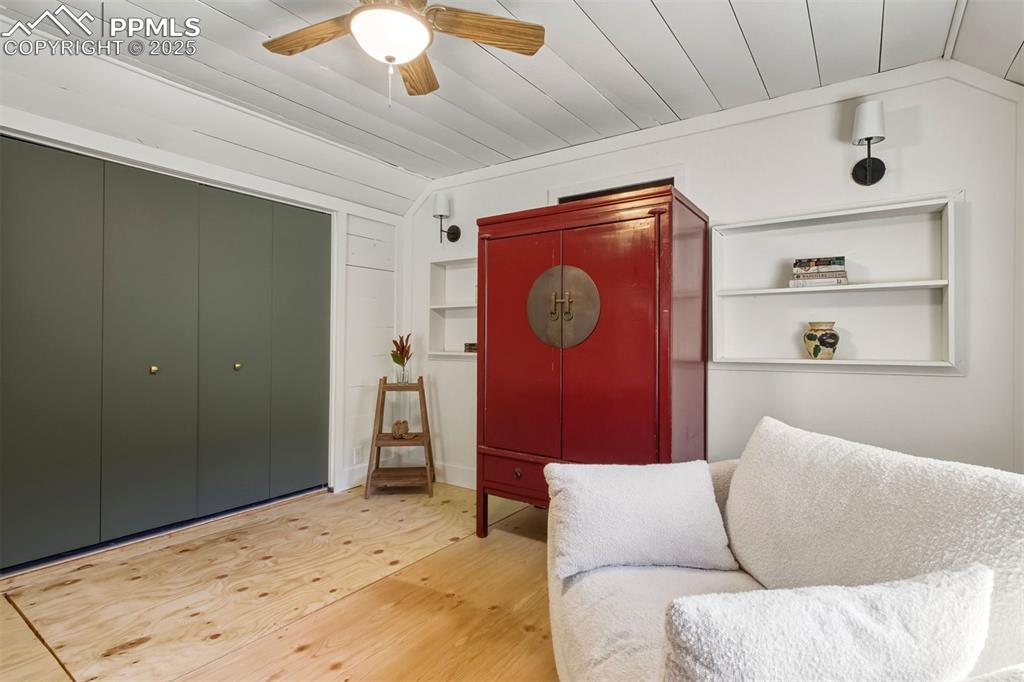 1144 Rock Creek Canyon Road, Unit A Colorado Springs, CO 80926 - Photo 31 of 50 a living room with a couch and a chandelier