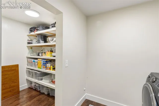 a bathroom with a sink vanity mirror and toilet